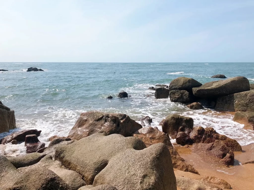 Ho Coc Beach's dramatic rocky formations 